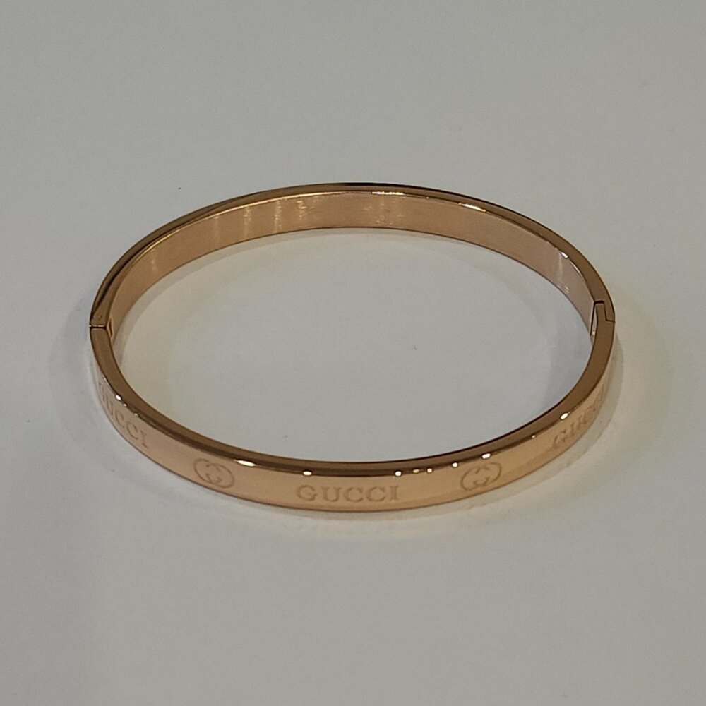 Rose colored monogramed bracelet that opens with pull. Brand new without tags. - Picture 3 of 5